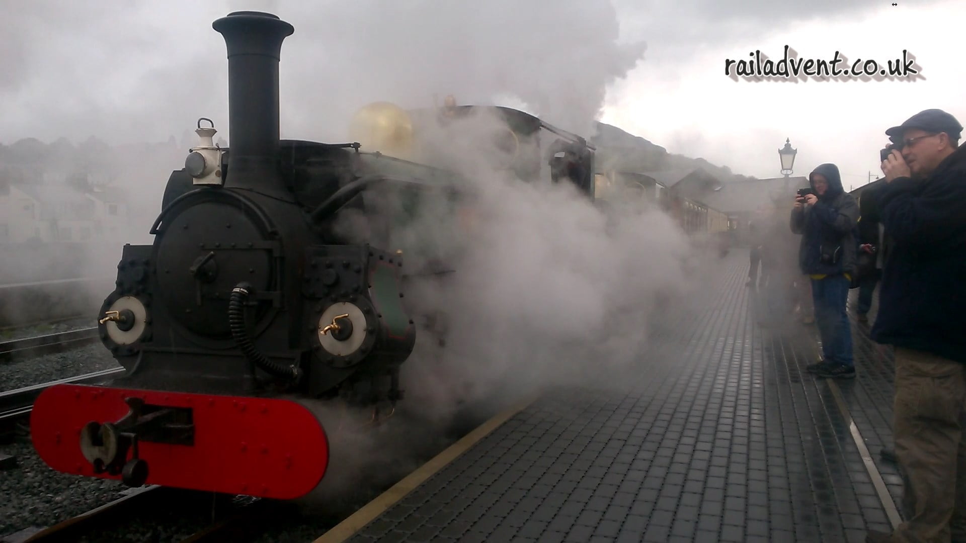 Linda and Blanche emerge through the steam departing Porthmadog