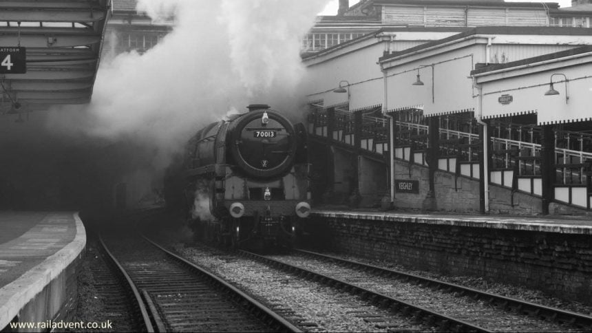 Oliver Cromwell bursts into Keighley platform 3 with a short freight train during a 30742 Charter