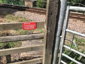 Trespass warning sign warning trespassers near Whitby not to use railway