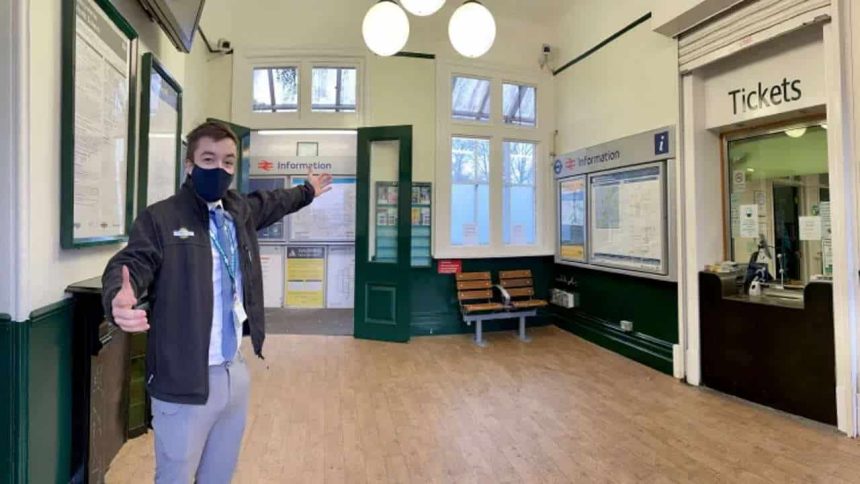 Station Manager Nathaniel Owen invites passengers to North Dulwich station's Twenties-style transformation