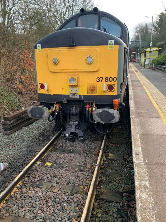 recovery locomotive trying to rerail damaged Merseyrail train