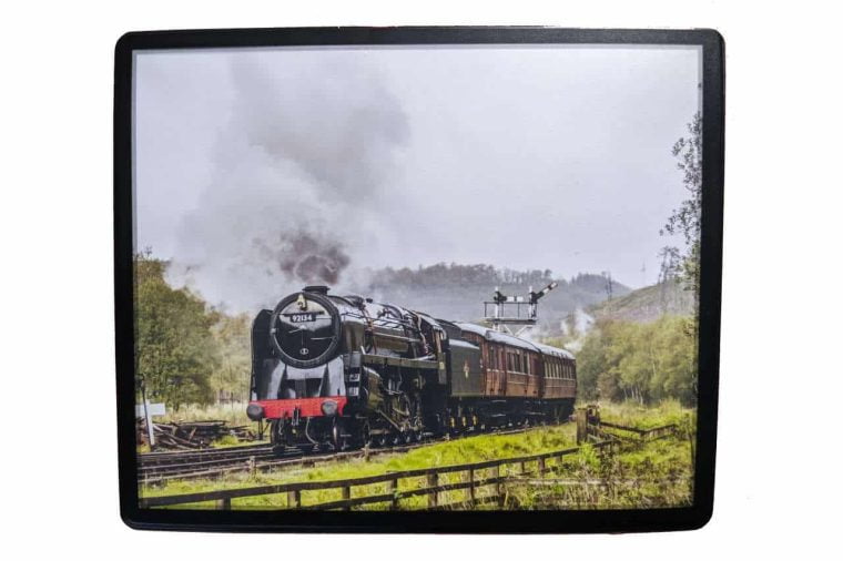 This plastic wipe-clean mouse mat features the 9F steam locomotive 92134 approaching Levisham on the North Yorkshire Moors Railway