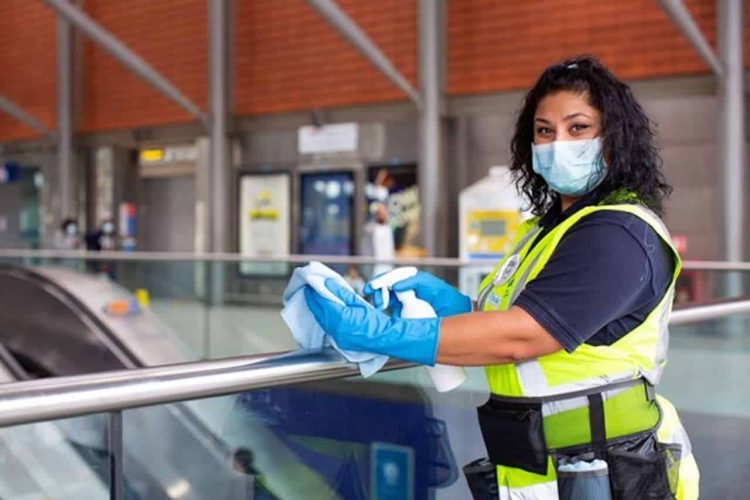 Transport for London worker cleaning