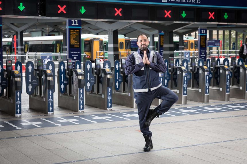Station staff at Barrier in Tree Pose