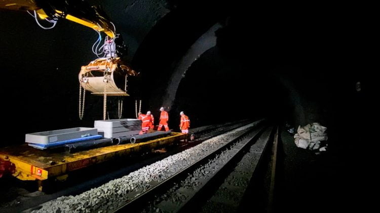 Work taking place inside Cowburn Tunnel at track level