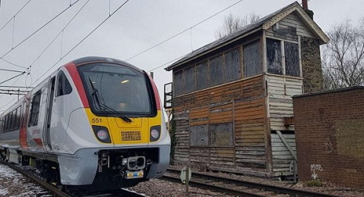 One of Greater Anglia's new trains at Hertford East next to the disused signal box