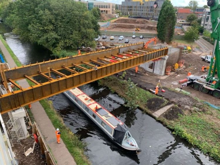 new bridge being built over a canal