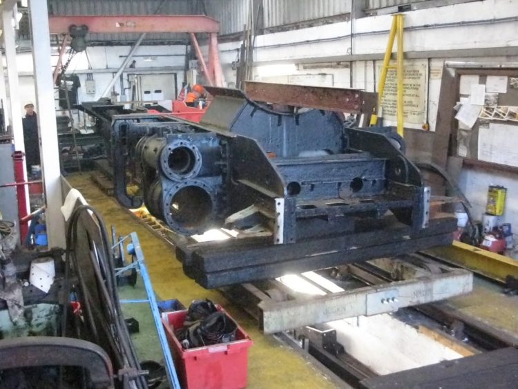 The Ivatt frame being lowered onto the transit bogeys outside the Group’s workshop.