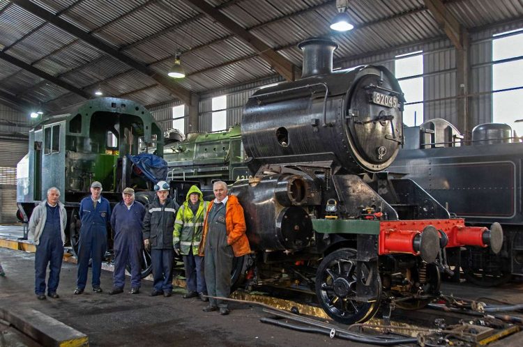 Members of the 82045 Steam Locomotive Trust with the now 2-6-2 back inside Bridgnorth shed. Photo: John Titlow.