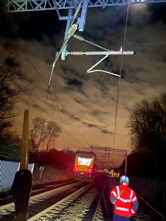 25,000 volt overhead lines in tangled mess after log thrown onto railway