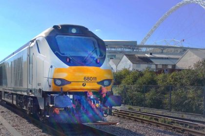 Chiltern train passing Wembley stadium stockshot