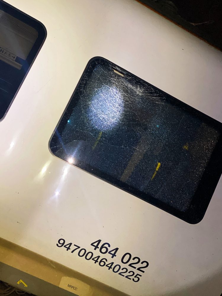 Damage to Northern train window after log thrown onto tracks