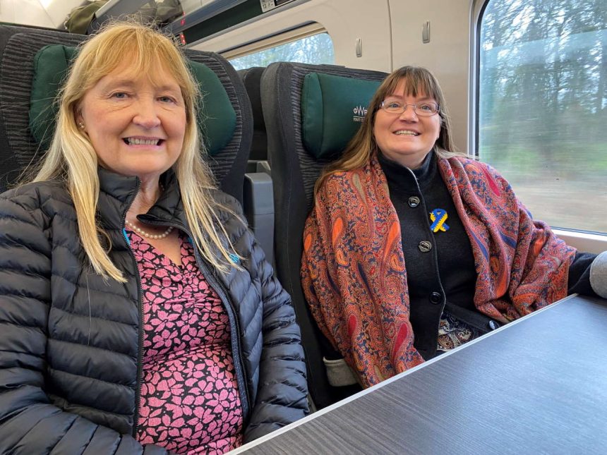 Liz and Naomi on a train