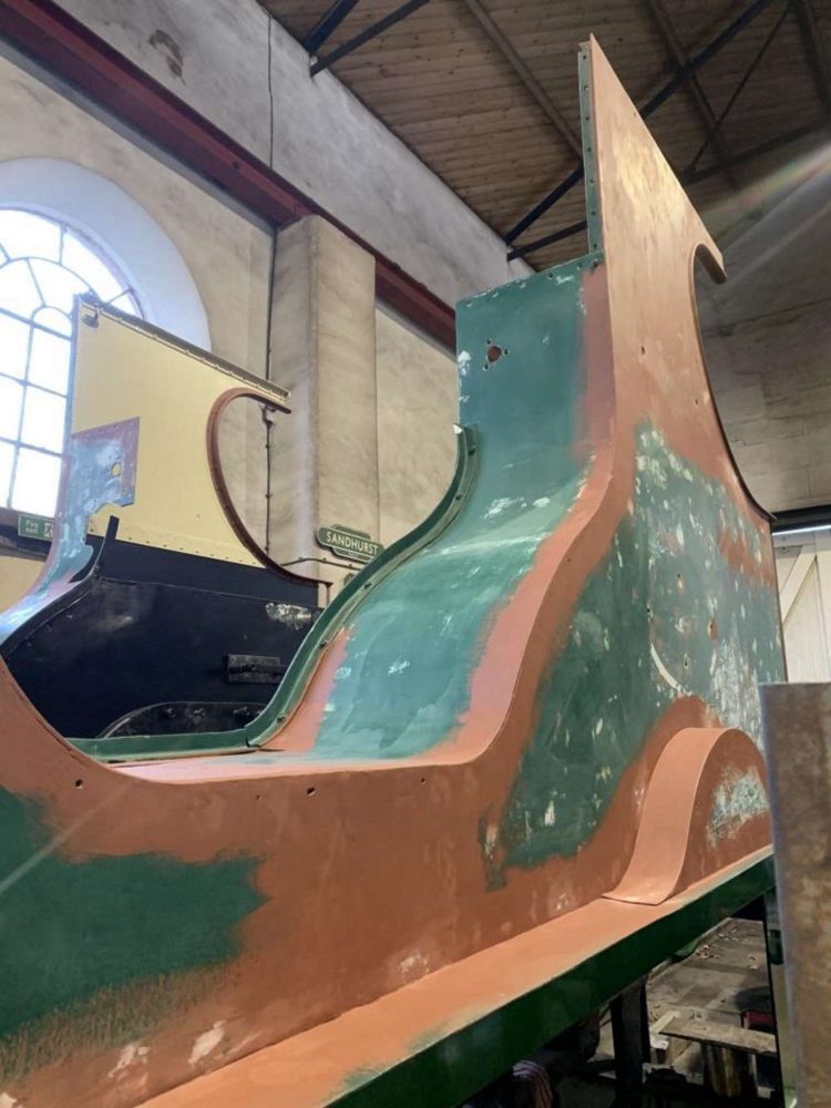 Work continues on preparing the cab sides and splashers for further coats of paint and test fitting the brass beading.