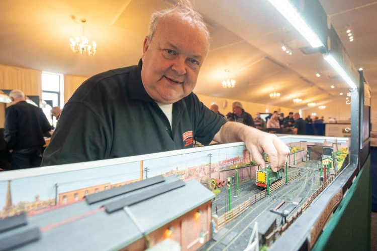 exhibitor with his model railway
