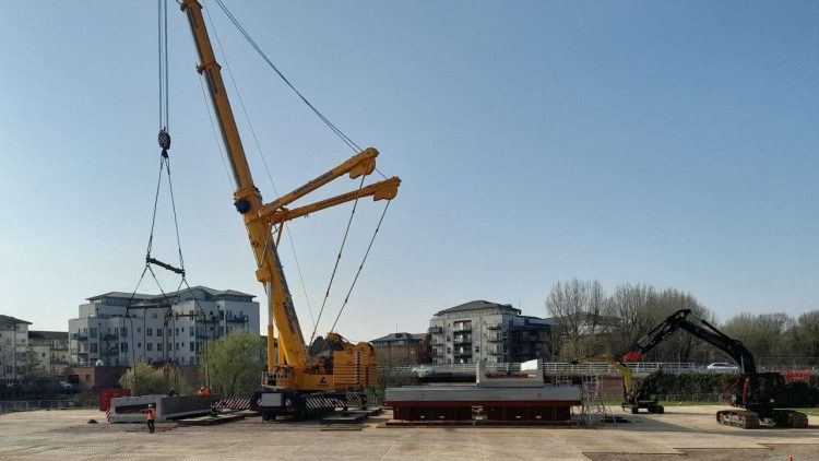 Large crane which will be used to lift new bridge onto huge transporter vehicle