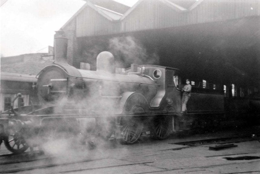 563 at Guildford shed 1958, we’ve been reliably informed the steam is from the loco shunting and not 563, George Burch.