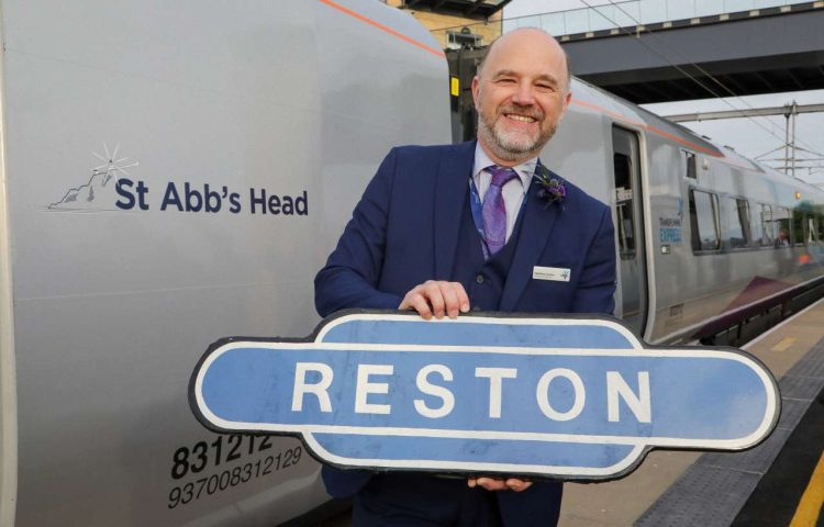 Matthew Golton, Managing Director of TransPennine Express with the newly named 'St Abb's Head' train, the first passenger service to stop at Reston Station in more than 50 years