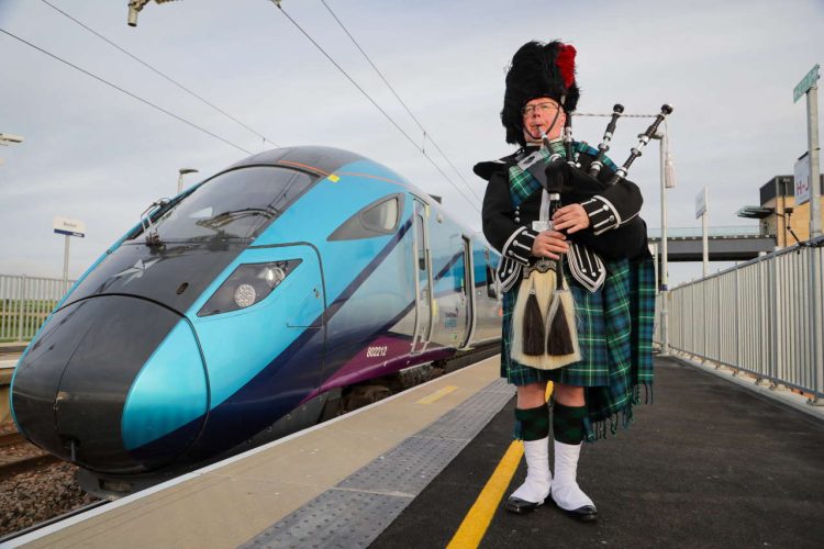 Sandy Mutch, the Border Piper, welcomes in the 6.16am TransPennine Express service to Reston Station