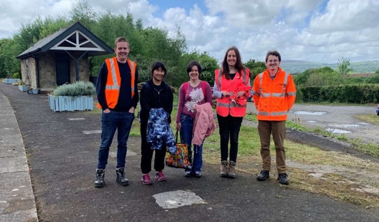 Volunteers at the Bere Alston railway station clean up in Devon