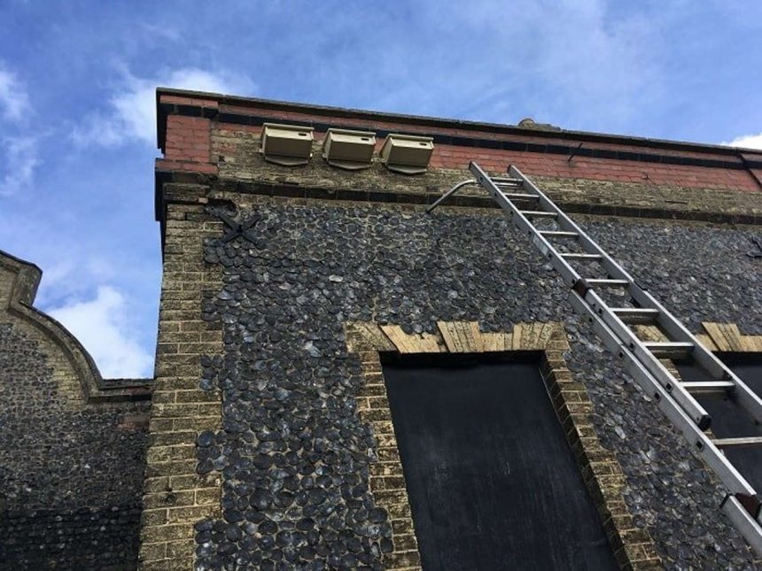 The swift boxes being installed on the station building