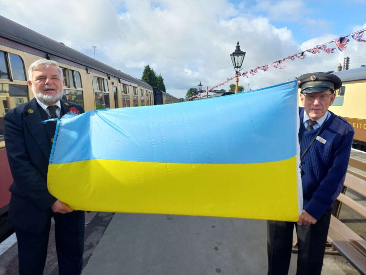 Volunteers Richard Cresswell and Geoff Smith fly the flag for Ukraine at the SVR.