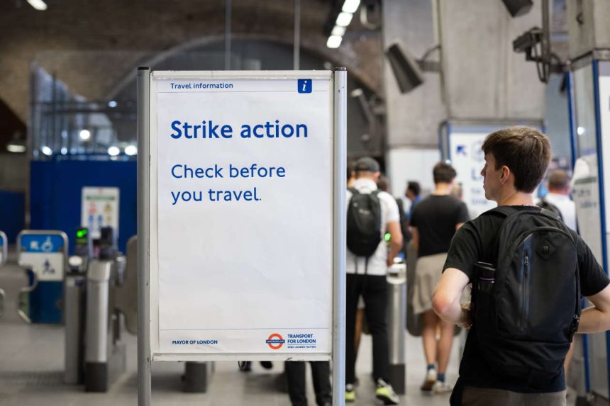 TfL Posters re travelling during strikes. Jubilee ticket hall and gateline, Waterloo Underground station. August 8, 2022.