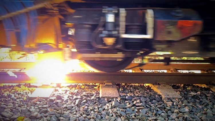 Close up shot of plasma jet cleaning rail head during Network Rail trials October 2022