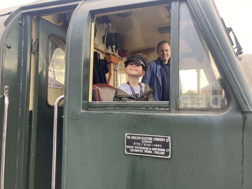 Corey Clark in the cab of heritage diesel 40106 with driver Dave Evans