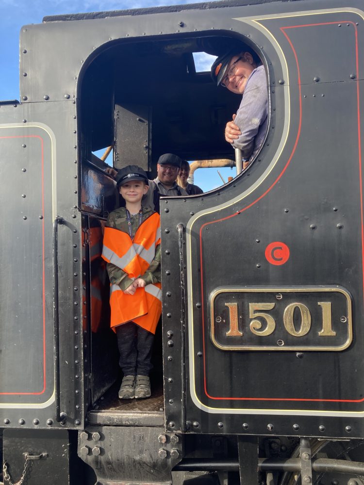 Corey on the footplate of No 1501 with the volunteer crew. Lesley Carr