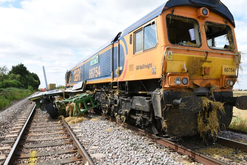 Collision between a train and agricultural equipment at Kisby user worked crossing