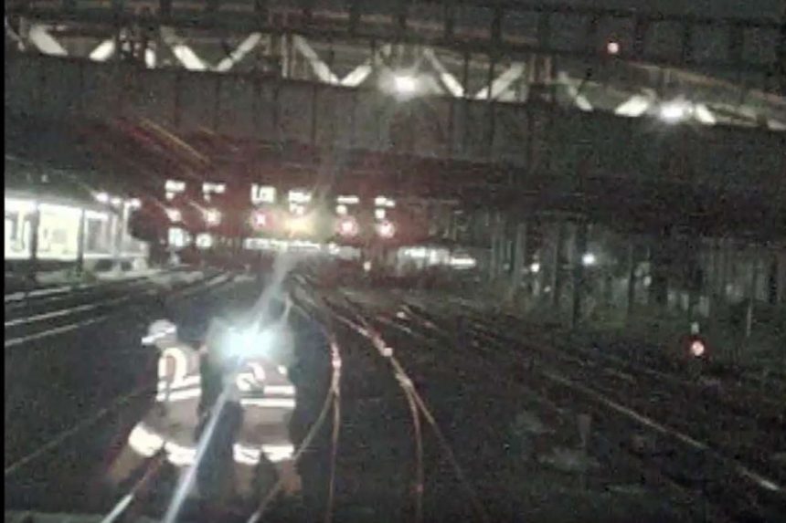 Forward-facing CCTV showing the two track workers moving clear of the train