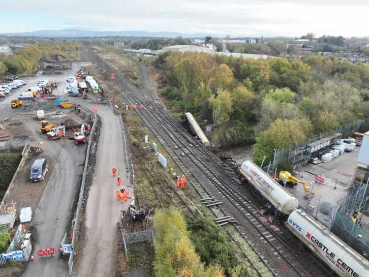 Aerial shot of derailed wagons being recovered.