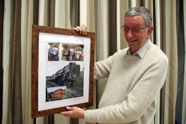 Alan Greatbatch being presented with a framed photograph following his 31 years of Volunteering with Swanage Railway as a signaller