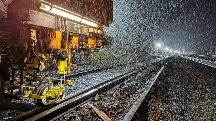 Track upgrades taking place in pouring rain during Watford to Euston blockade