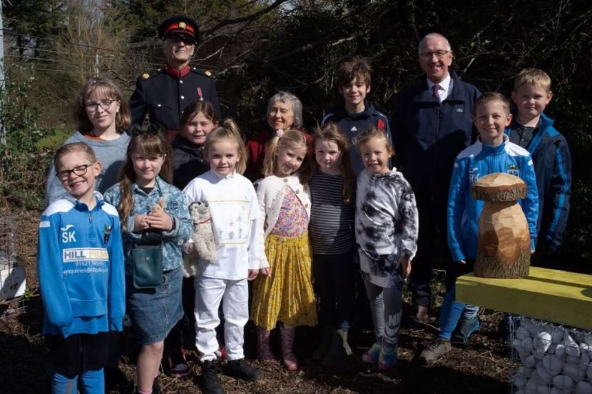 Children of Wix & Wrabness Primary School with Nigel Spencer MBE, Deputy Lord Lieutenant of Essex, station adopter and local resident Julia Prigg and Luke Dixon of the Bee Friendly Trust.
