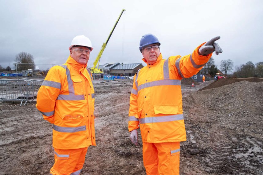 Cllr Tony Brennan and Steve Rotheram, Mayor of the Liverpool City Region, look at the progress so far on the new Headbolt Lane station site.