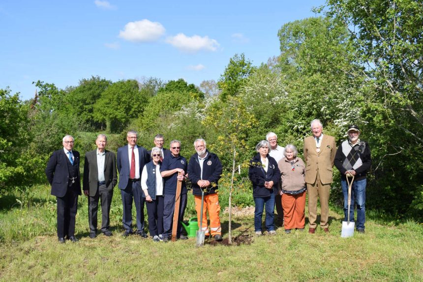 Deputy Lieutenant of East Sussex John Moore-Bick CBE DL (second from right) with the Chairman and Directors of the K&ESR plus forestry and station volunteers at the tree planting at Bodiam