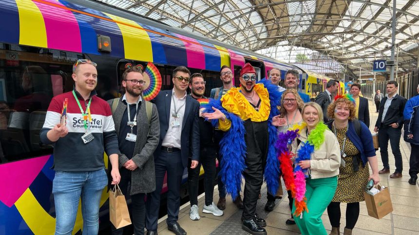 Eurovision superfans getting off specially branded London Northwestern Railway train at Lime Street May
