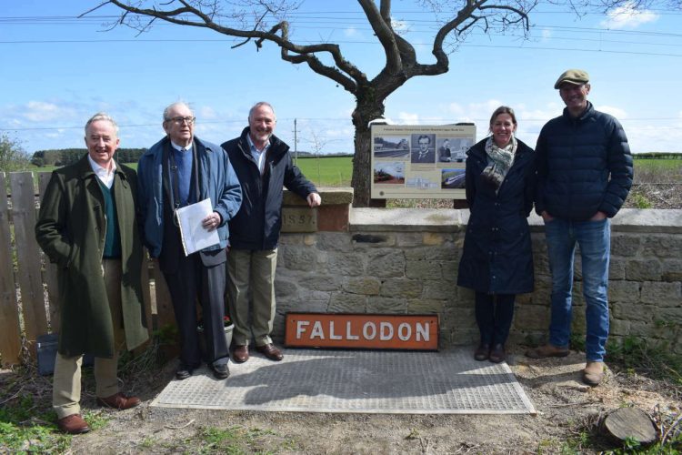 The unveiling of the information board at Fallodon, 25 April 2023. Left to right: Adrian Graves, great-great nephew of Sir Edward Grey; Robert Young, local farmer and owner of the signal box name board; Neil Mackay, Chair, North Eastern Railway Association; Lucia and Mark Bridgeman, owners of Fallodon Hall. 