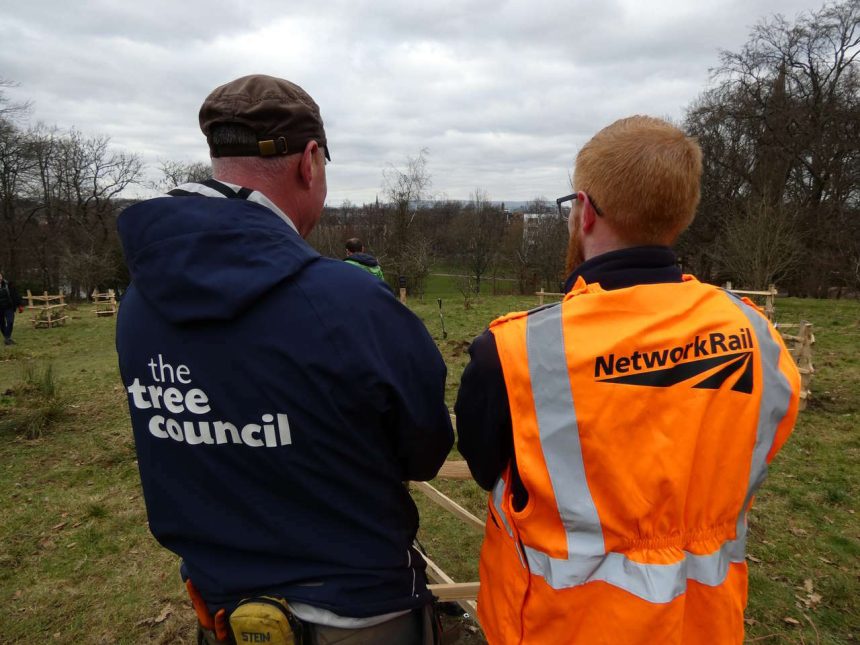 A Network Rail worker and a person a part of the tree Council