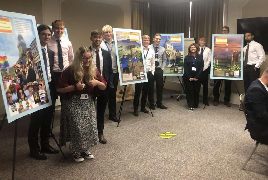 The students alongside their posters