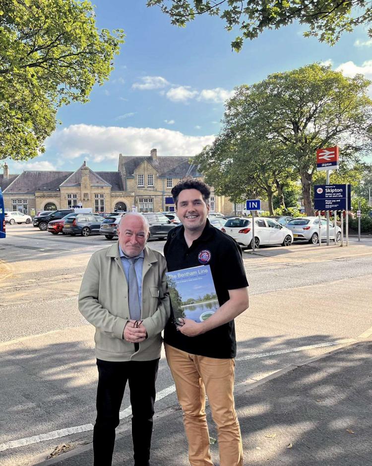 Gerald Townson with Huw Merrimann outside Skipton Station