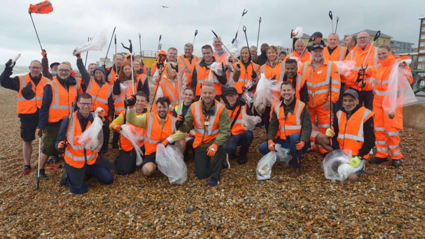 Soaking but happy with a job well done: GTR's Head of Environment Jason Brooker (centre) and the team at Brighton & Hove beach