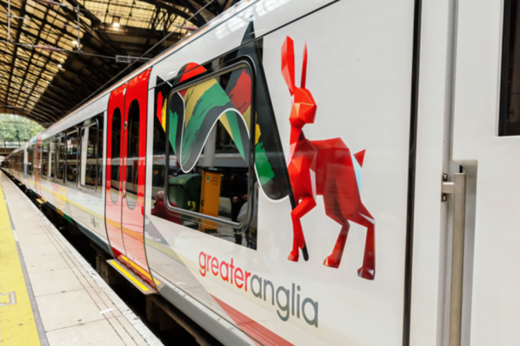 The Greater Anglia 'Hare' waves the Black History Month flag // Credit Greater Anglia