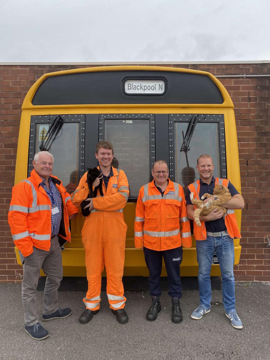 Northern colleagues Simon Crabtree, Matt Lodge with Max the cat, Gary Pennington and Steve Gordon with Ginge the cat