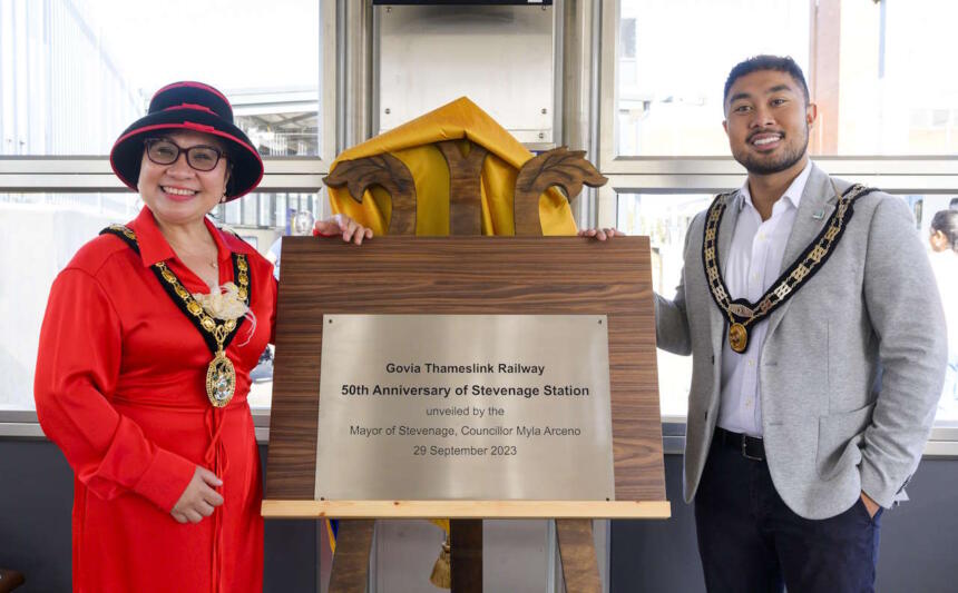 Mayor of Stevenage, Cllr Myla Arceno, unveils the station's birthday plaque with Mayor's Consort John Arceno