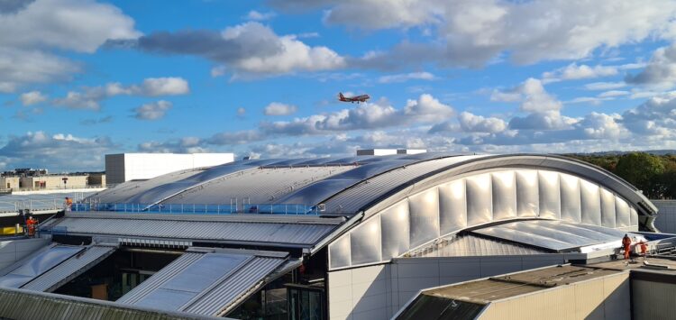 A plane arriving at Gatwick Airport above the new concourse // Credit: Network Rail