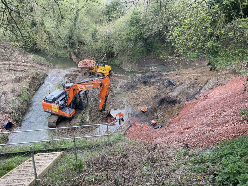 Clearing gravel deposits from the River Isbourne bed