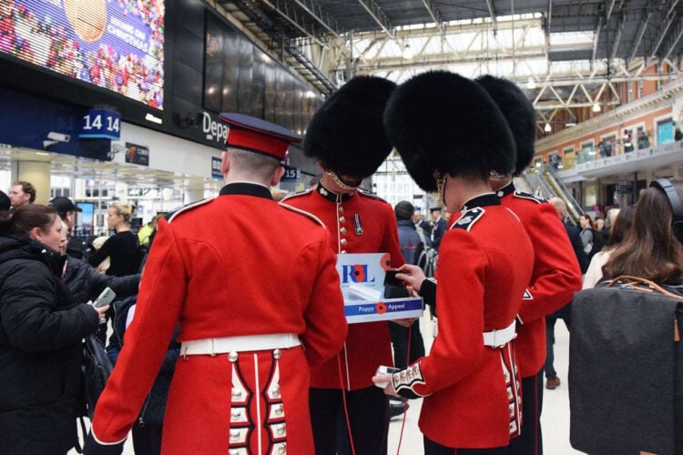 Grenadier Guards collecting at Waterloo on London Poppy Day. // Credit: South Western Railway